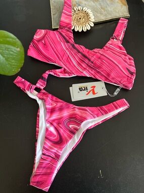 Yira pink one piece with circle  details size large